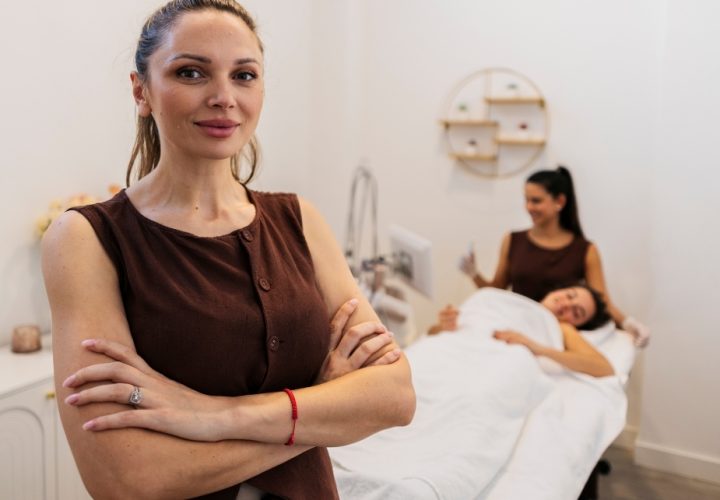 Businesswoman with spa in background